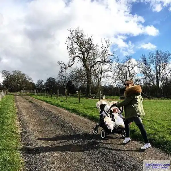 Mikel Obi’s Girlfriend, Olga, Takes A Walk With Their Twin Girls In A Stroller